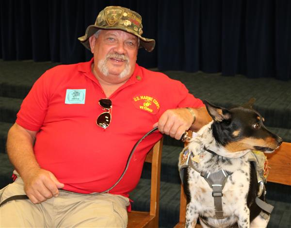 Vietnam veteran Ed Denzin sits next to his service dog Ginger Vietnam veteran Ed Denzin sits next to his service dog Ginger